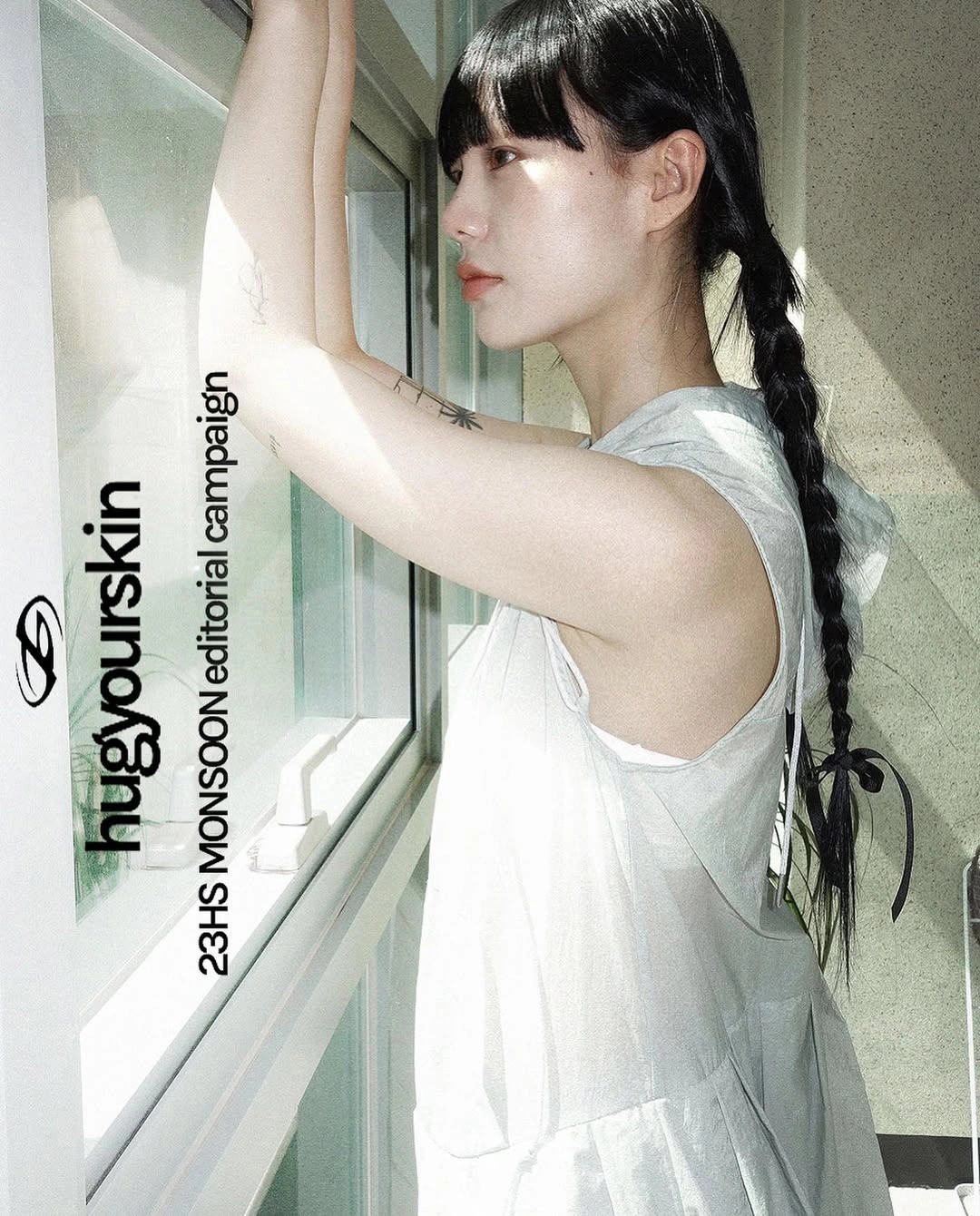 A white dress and raised arms in soft daylight